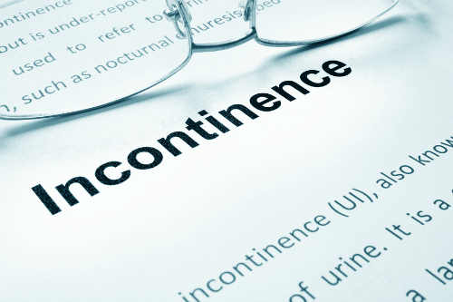 Glasses on a paper that reads 'Incontinence'