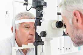 Elderly man getting an eye exam
