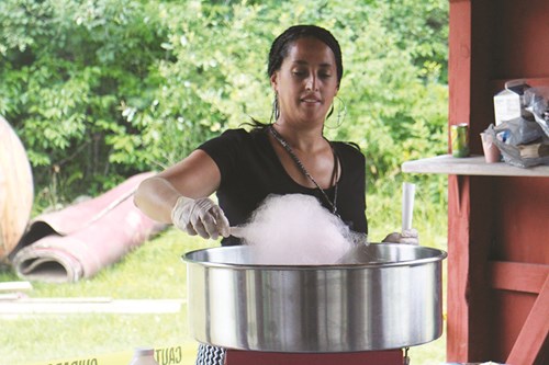 Marilyn Negron, a consumer directed personal assistance program coordinator, makes cotton candy.