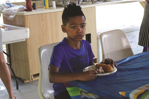 Markese Jones Jr., 8, of Amsterdam, enjoys his lunch.