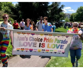 Image of people walking at Ann's choice Pride parade