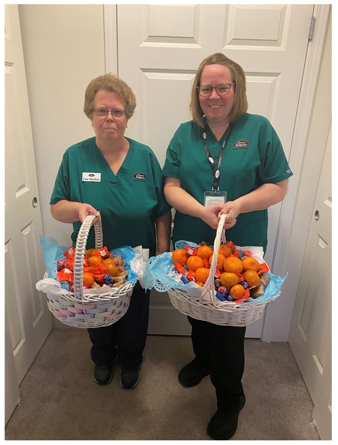 Staff members holding easter baskets