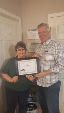 Linda Stanley and man holding certificate