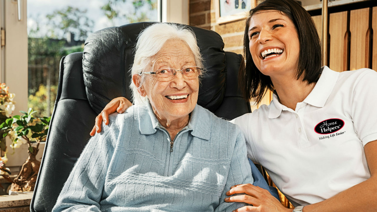 A Home Helpers caregiver provides live-in care for seniors for an older woman in her home.