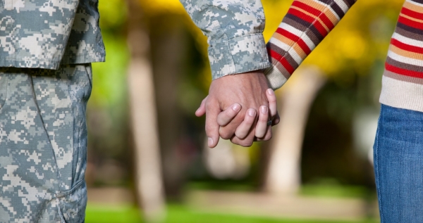 veteran holding hands